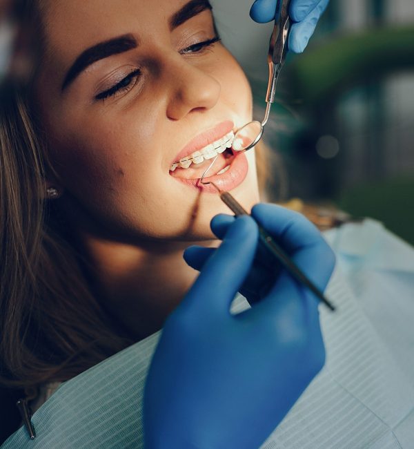 Beautiful lady in the dentist's office. Woman in a uniform